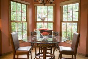 Symmetrical windows overlooking a dining room table